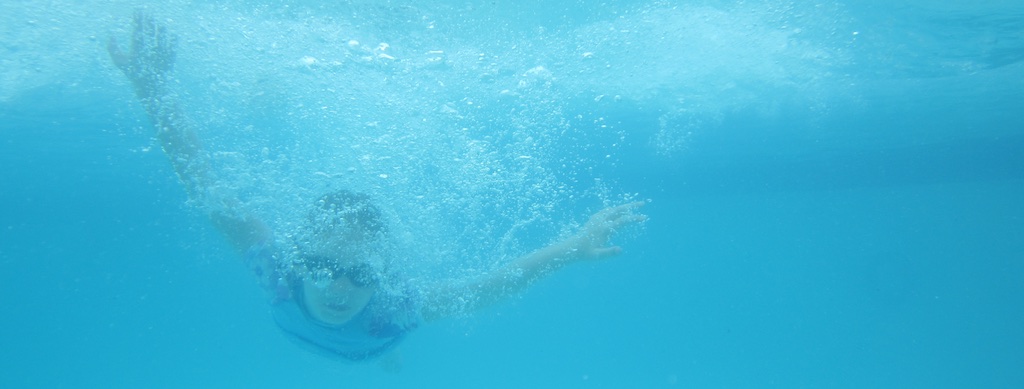 Swimmer diving under water